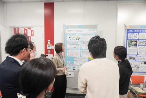 Our company will also be presenting (center, in front of the poster)